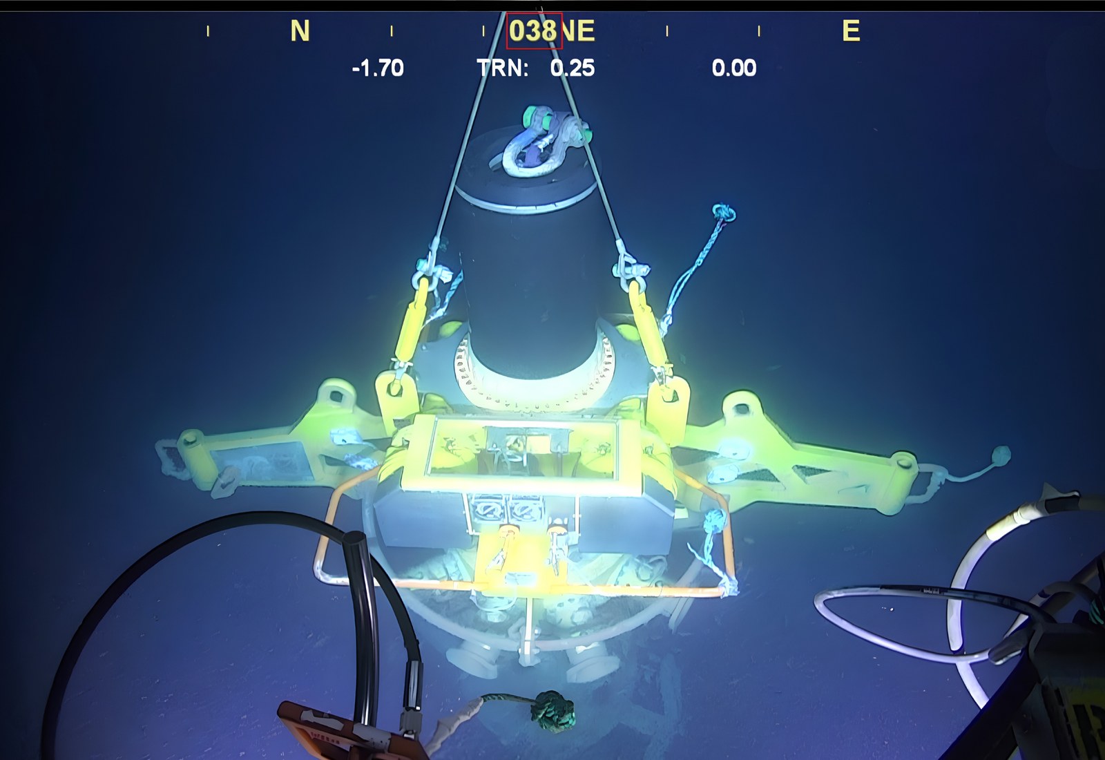 The wellhead connection system under the crane on its way to the seabed