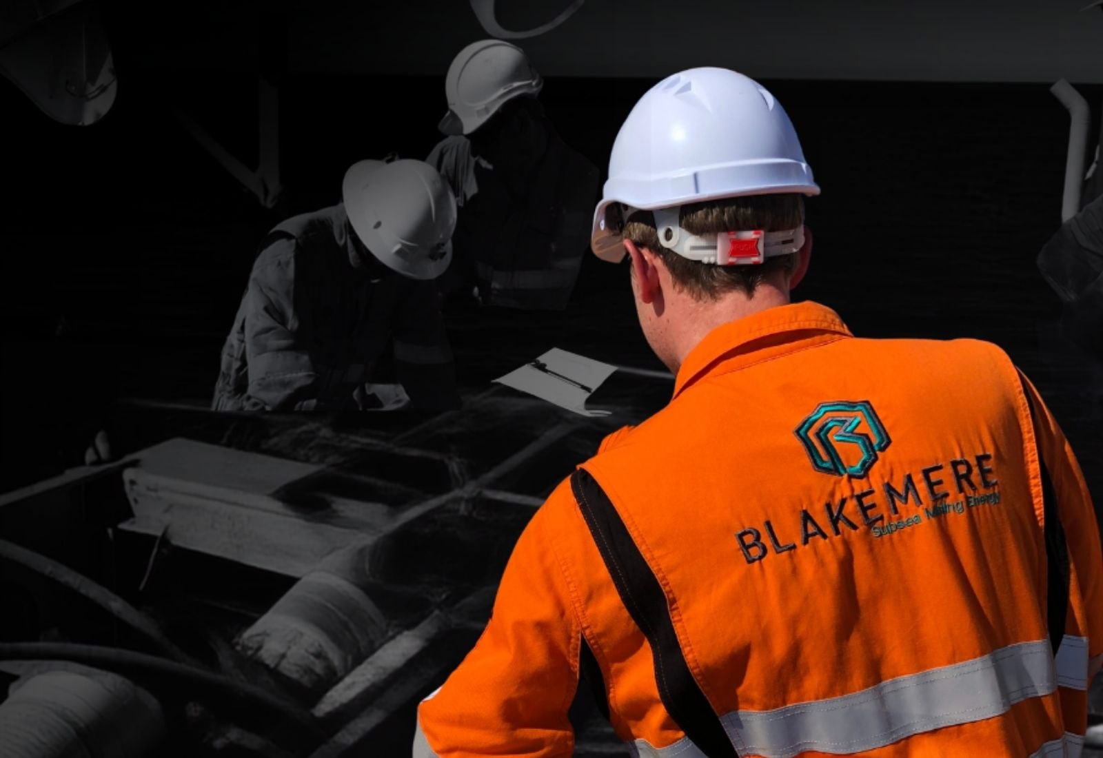 Blakemere engineers working over tooling on a workshop bench