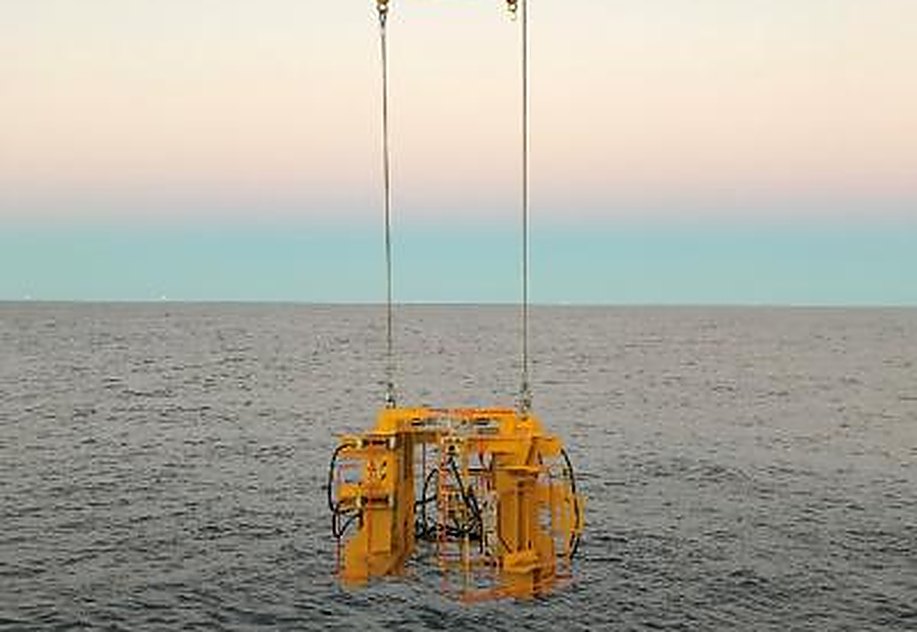 The buoyancy module removal tool being deployed over the side