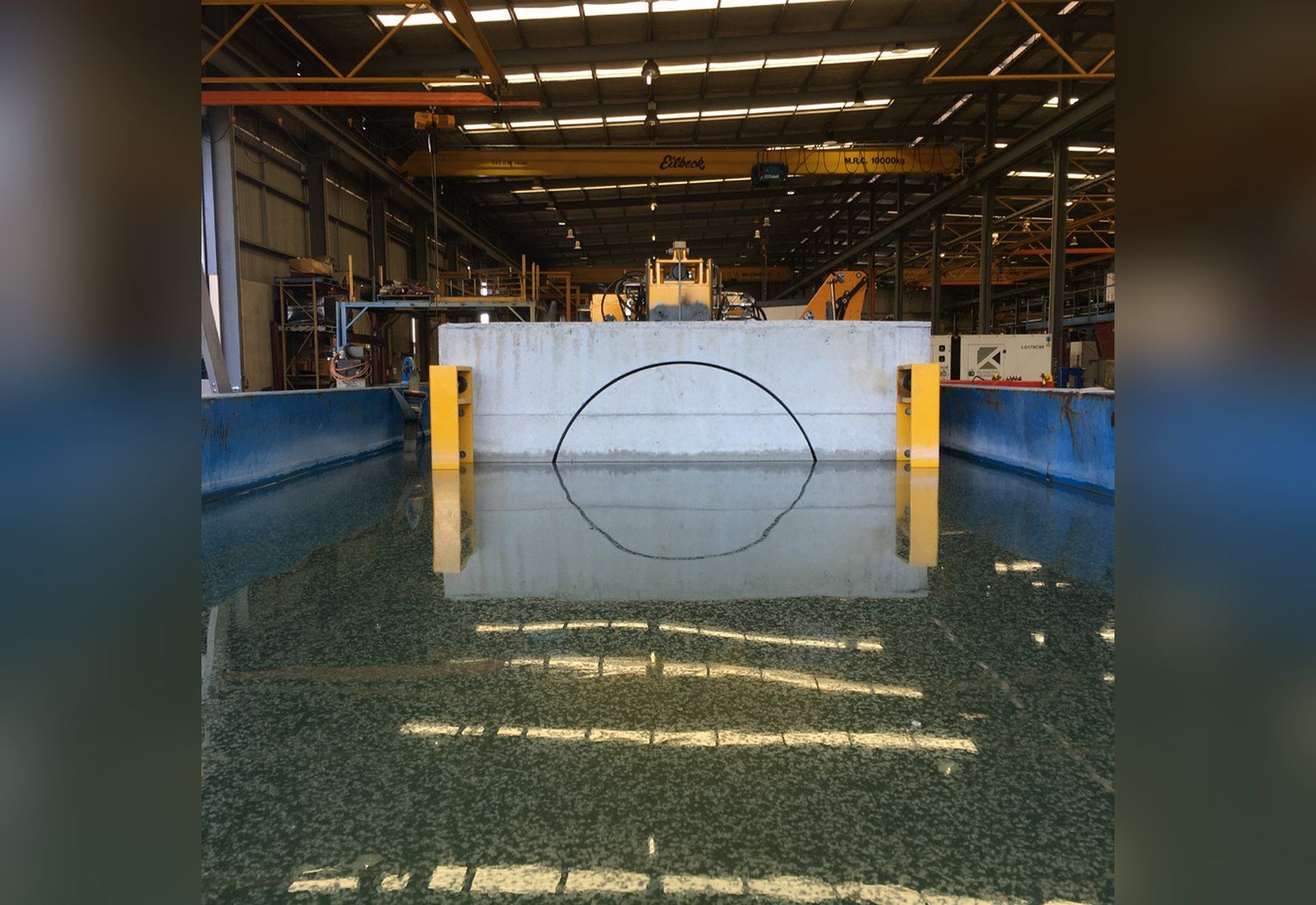 Trial cuts on cast concrete blocks of representative strength, filled with granite from the weir site
