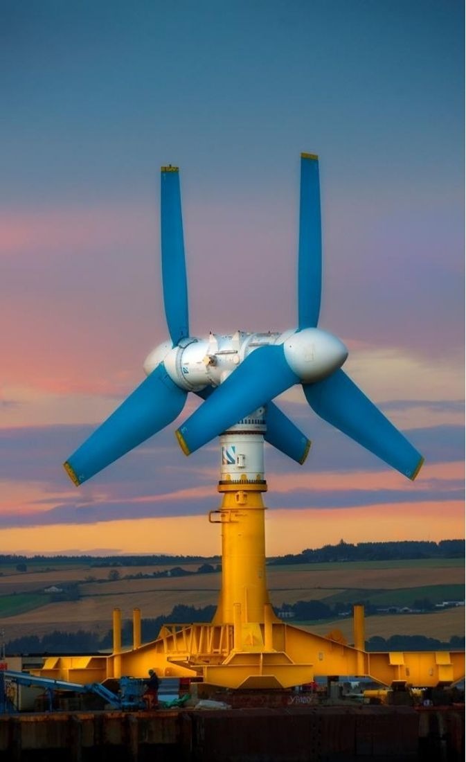 A twin-rotor tidal turbine on its support structure at dusk