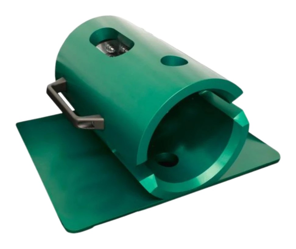 Class 5 torque analyser, a green cylindrical body open at one end with two windows in its side and a black carry handle, sitting on its green support plate