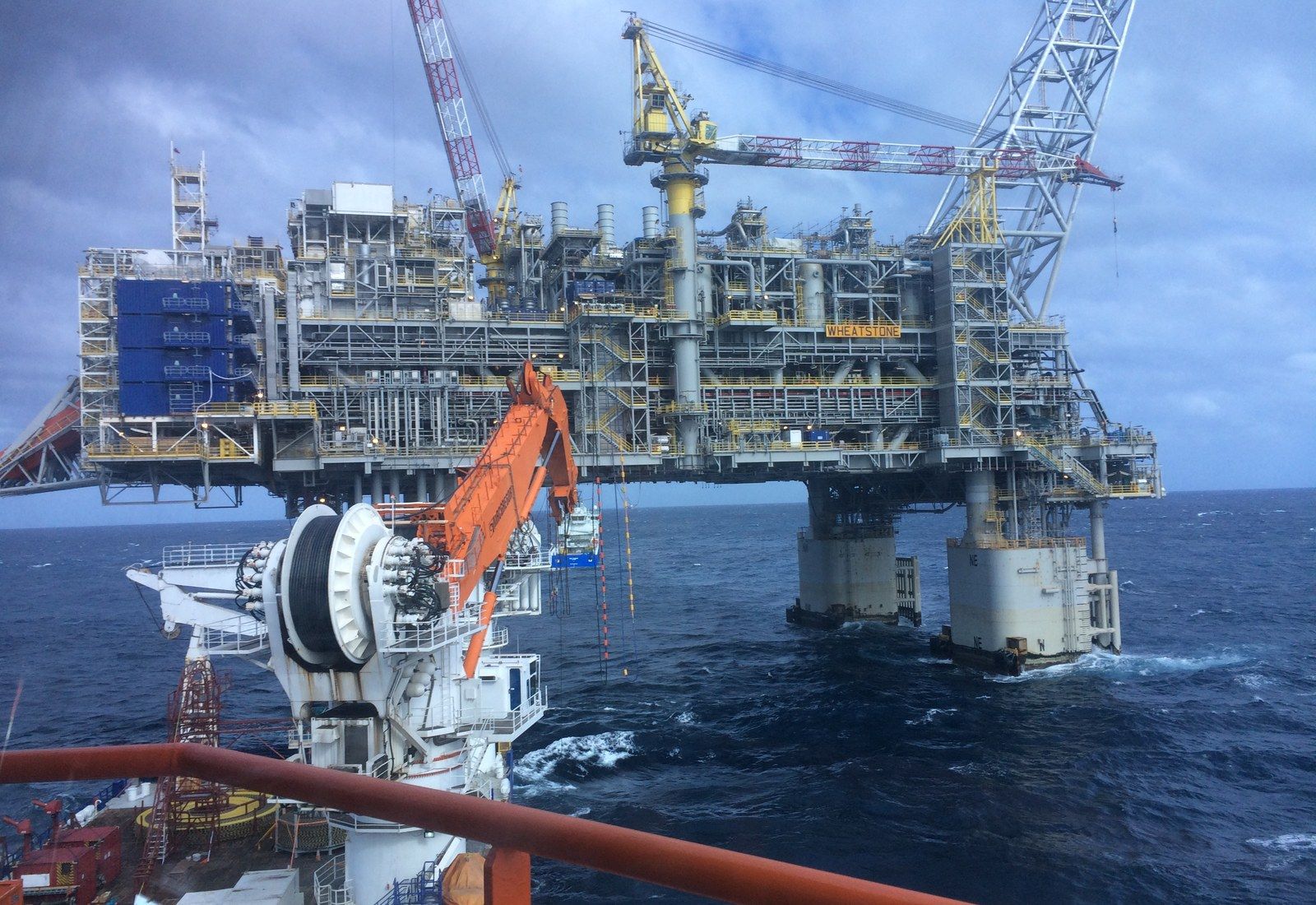 An offshore construction vessel working alongside a gas production platform on the North West Shelf